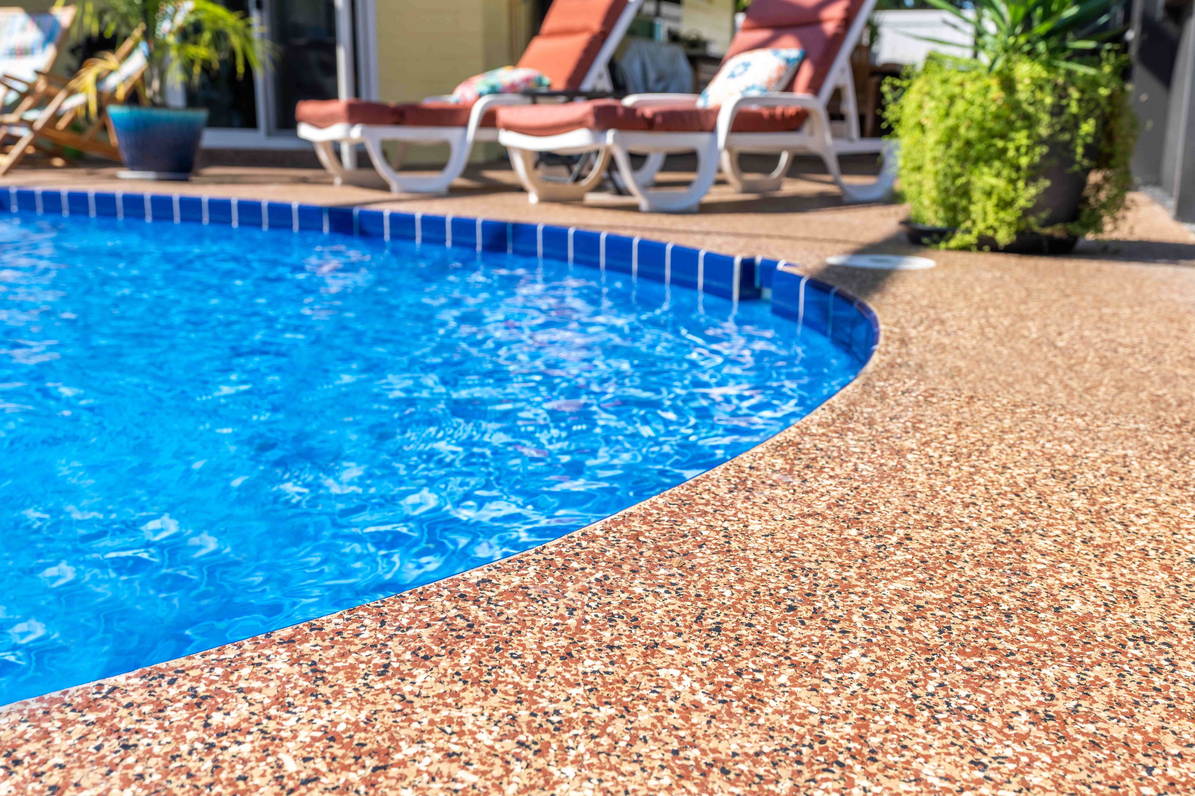 Premium polyurea pool deck coating with slip-resistant terracotta finish